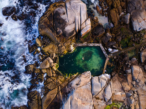 Aerial view of Saunders Rock tidal pool in summer at Bantry Bay, Atlantic Seaboard, Cape Town, South Africa.