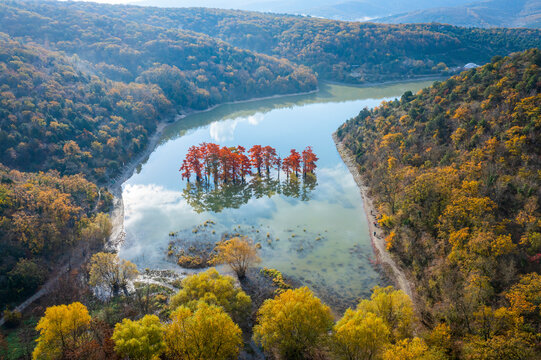 Aerial view of Cupressus Lake with low clouds and fog, Sukko village, Krasnodar Krai province, Russia.
