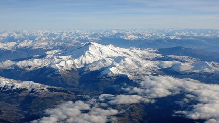 Naklejka premium Aerial view of snow capped mountains range with clouds in foreground Alps Switzerland landscape photography