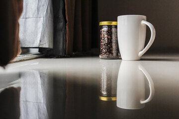 Smooth Focus and soft Focus,Hot coffee in a cup of coffee placed on the bedroom floor by the window in the morning was placed to prepare for drinking coffee before work.