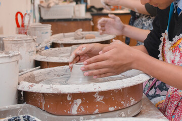 students sculpting in ceramics class 