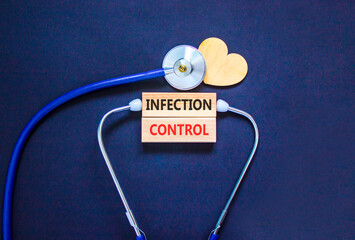 Infection control symbol. Concept words Infection control on beautiful wooden blocks. Wooden heart...