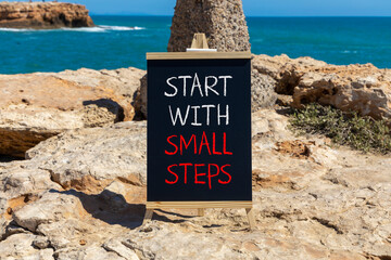 Start with small steps symbol. Concept words phrase Start with small steps on beautiful black...