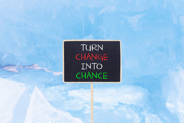 Turn change into chance symbol. Concept words phrase Turn change into chance on beautiful black...