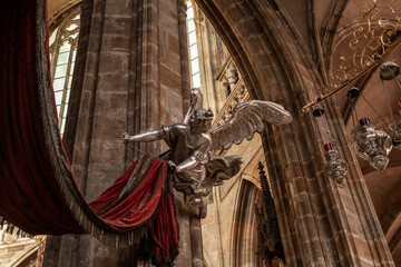 Large silver angel as decoration in interior of the St Vitus Cathedral in historical part of Prague in Czech Republic