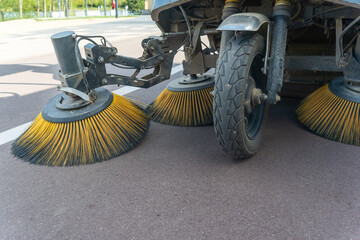 Innovative electric street sweeper efficiently cleaning pedestrian walkways and bike paths for a...