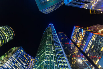 Modern high glass skyscrapers in the night