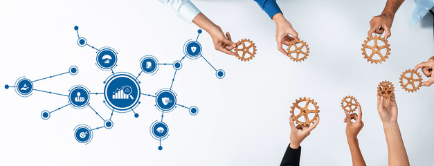 A diverse team engages in collaborative management strategies, showcasing gears and graphs, symbolizing innovation and strategic planning for successful business development. Amity