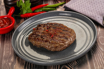 Grilled beef burger cutlet with sauce
