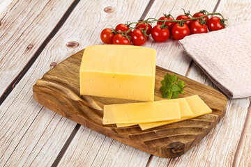 Yellow cheese piece with slices