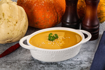 Vegan pumpkin cream soup served sesam