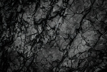 Dark gray stone background with Black white rock texture for design, cracked rough mountain surface close-up