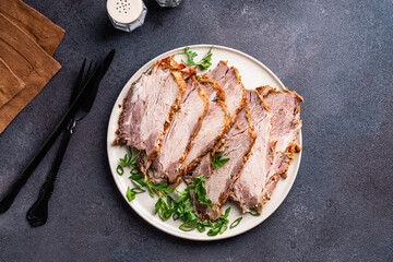 Pork roast, slices of meat in plate