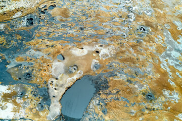 Hverir, Iceland. Unique aerial view of geothermal landscape with colorful earth formations and...