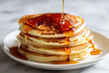 Stack of Pancakes Being Drizzled with Maple Syrup on White Plate Close Up Food Photography Breakfast Still Life