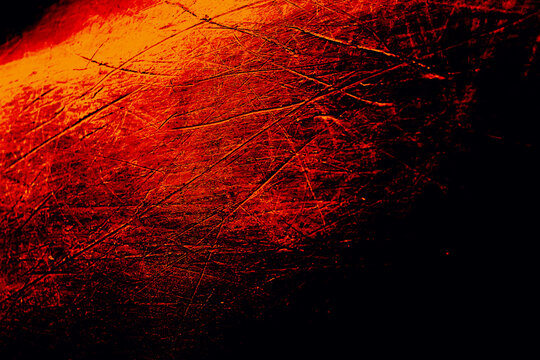 intense black red and orange gradient backgound with copy space. versatile scratched relief design element for dramatic abstract heat, fire and apocalyptic concepts.