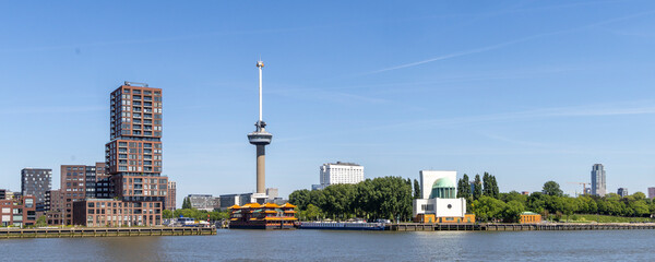 Panoramic skyline with famous Euromast tower, floating Chinese restaurant and Maas tunnel building in Rotterdam The Netherlands