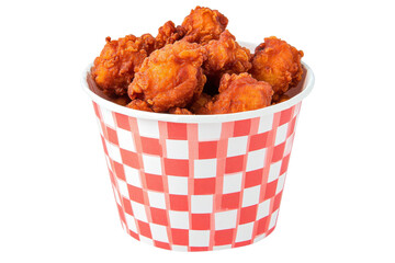Crispy chicken bites overflowing from a redcheckered bucket against a stark white background