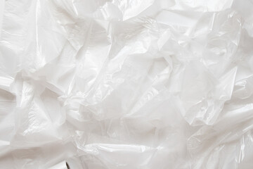 Background of crumpled white polyethylene bags, plastic texture for design, ecology