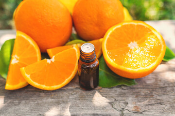 orange essential oil in a bottle. Selective focus.