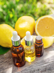 lemon essential oil in a bottle. Selective focus.