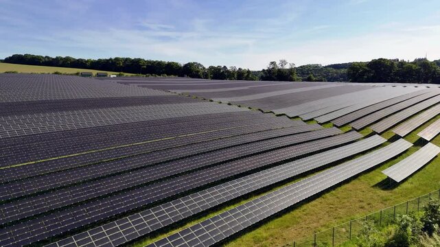 Aerial View of Large Solar Farm on Rolling Hills Near Bitburg, Germany