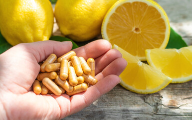 lemon essential oil in a bottle. Selective focus.