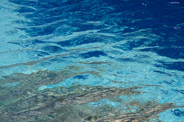 Sunlit Blue Pool Water Texture, Close-Up Abstract View