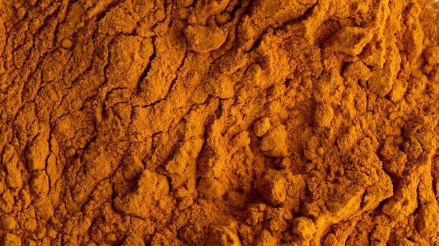 Closeup of rotating of herbal organic Turmeric spice