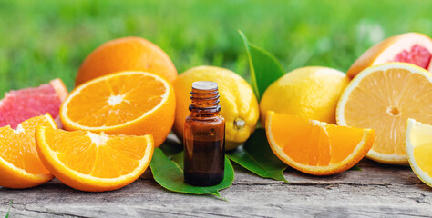 citrus essential oil in a bottle. Selective focus.