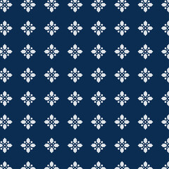 Intricate White Geometric Cross Pattern with Dotted Center on Dark Blue Background