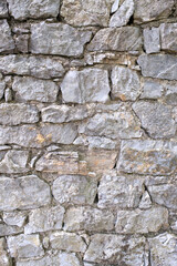 A stone wall texture showcasing a gray rock pattern Great for backgrounds textures and graphic designs