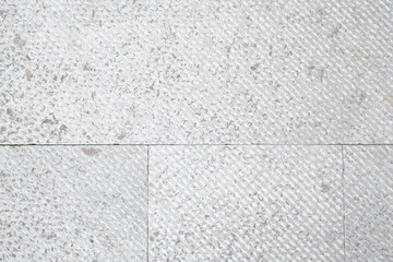 Fototapeta premium Textured stone tiles: subtle grey and white geometric pattern neutral tone