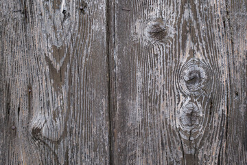 Fototapeta premium Weathered wood texture with visible grain and knots showcasing rustic charm and natural aging in a close up shot