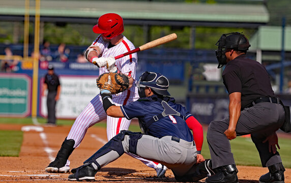 left handed baseball player hitting
