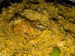 rice, paella, spanish cuisine, saffron, paprika, vegetables, meat, seafood, top view, close up
