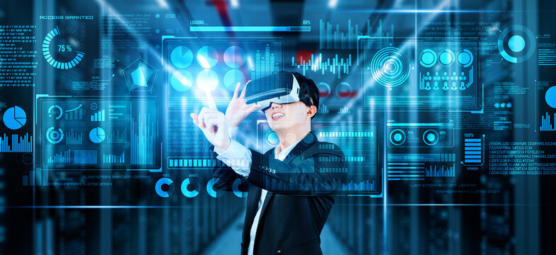 Businessman with headset standing at data center while analyzing financial data. Manager pointing marketing statistic hologram and using augmented reality goggles while making a decision. Ingenuity. - Powered by Adobe
