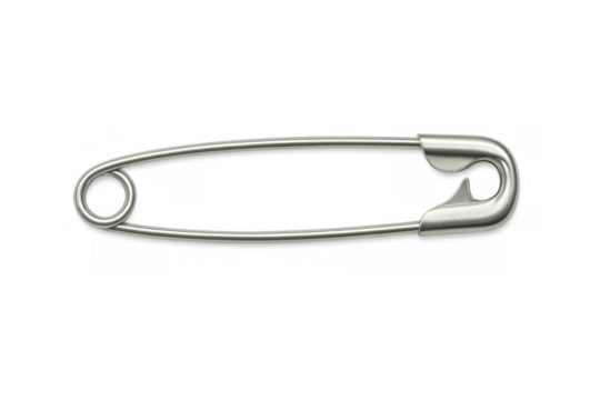 Metallic safety pin gleaming, sharp point secured, fastening mechanism visible against clean transparent backdrop