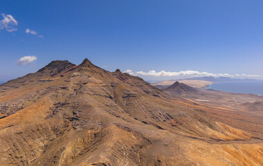 Dramatic aerial panoramic image of Montana Cardon, the Jandia peninsular and the volcanic mountain...