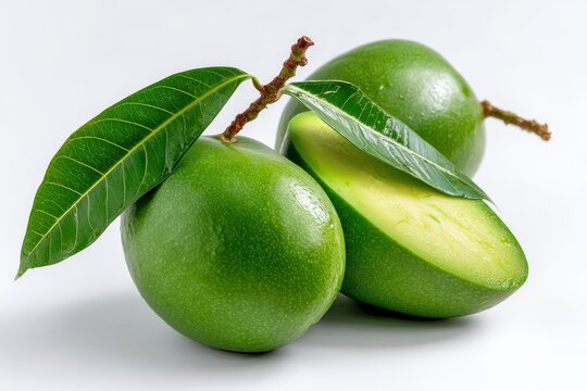 Green mango fruit with leaves and stem isolated on white background, organic raw mango image for pickling, food design, and health visuals