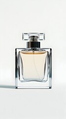 A clear, square glass perfume bottle with a silver cap, containing light yellow liquid, sits on a white background, casting a subtle shadow