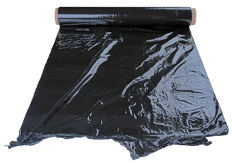 Black stretch film wound on a paper roll. Isolated background.
