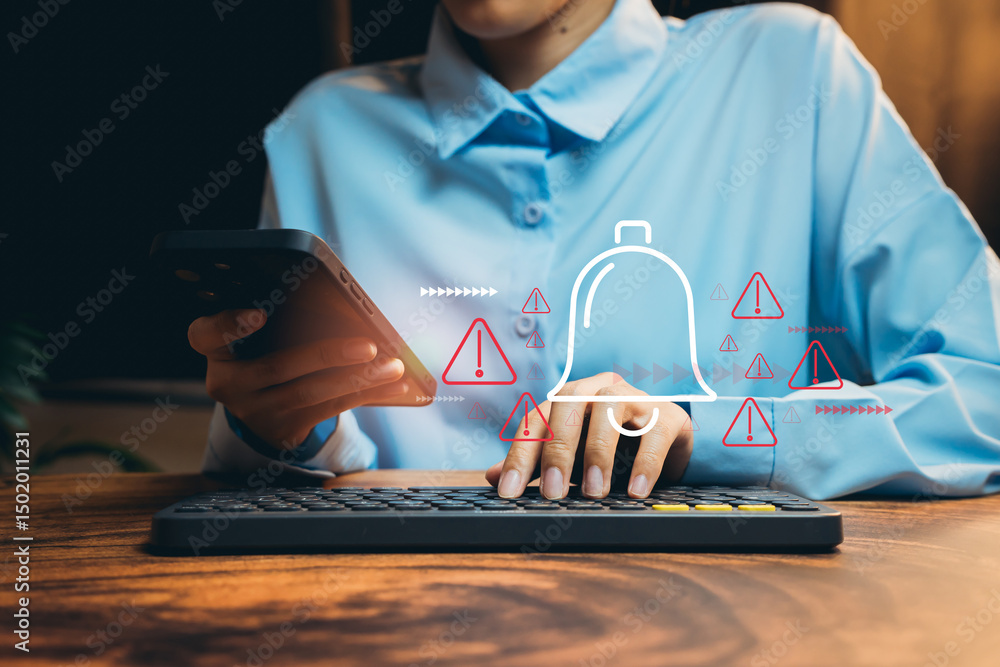 Poster person using smartphone and typing on computer with notification icons in modern office environment,