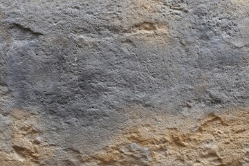 Textured Stone Wall: A Rustic Gray and Beige Surface