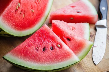Triangular watermelon slices on cutting board