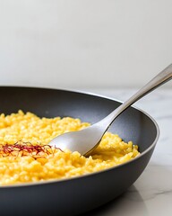 Classic Risotto alla Milanese originating Milan Italy creamy with saffron providing essential carbs and anti inflammatory properties for energy and wellness