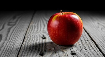 Shiny Red Apple on Rustic Wooden Table