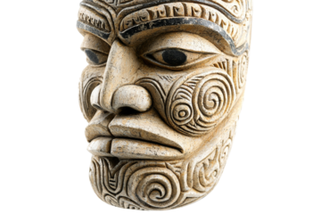 Carved face with a black eye and a white nose
