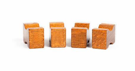 Set of four blank wooden printing blocks for movable type isolated on white background, vintage style empty letterpress font pieces with copy space, mockup, retro typography concept closeup, nobody