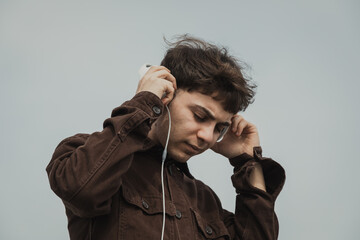 Man Realxing On The Shore During Spring While Listening To Music 